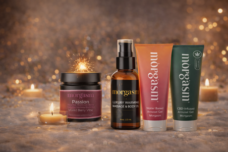 Morgasm’s four core intimacy products—Passion gummies, warming massage oil, and two arousal gels—arranged in a candlelit setting that represents an intentional intimacy ritual.