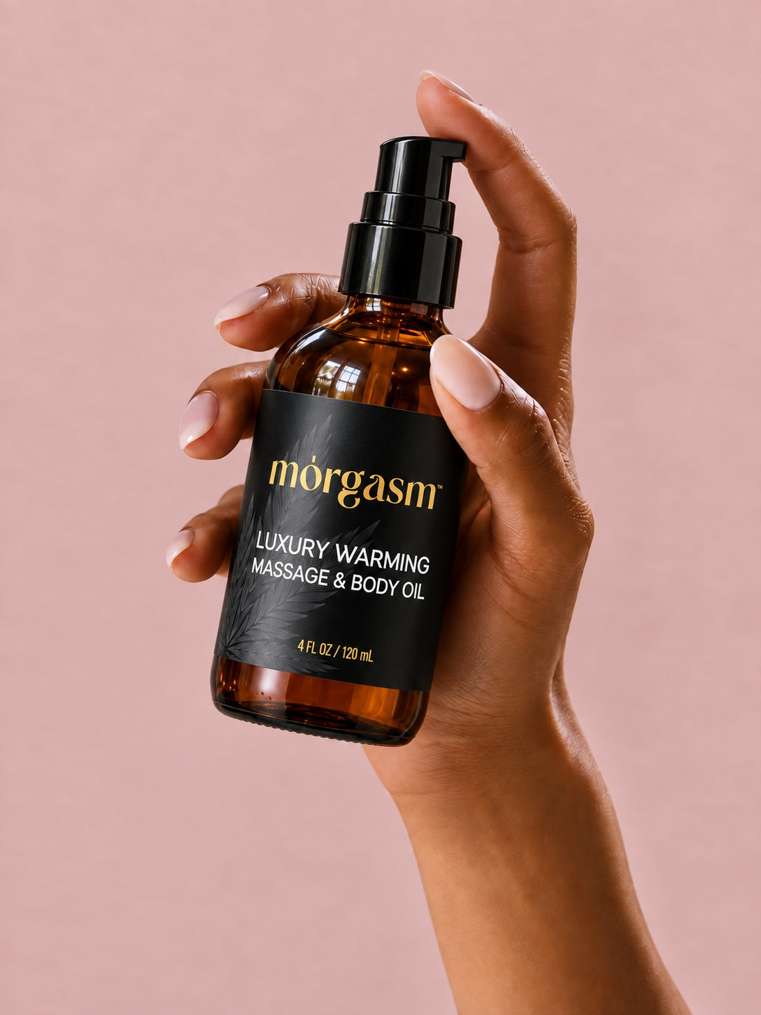 Holding the Luxury Warming Massage and Body Oil